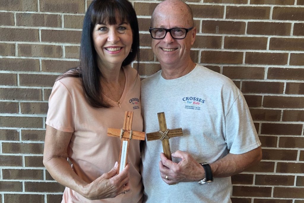 Crosses for Kids Jeff Kelley holding Cross