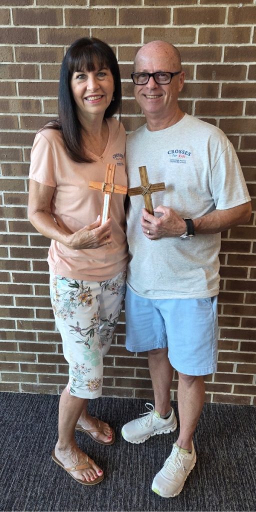 Crosses for Kids Jeff Kelley holding Cross Vertical